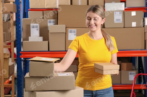 Preview: Post office worker with parcels near rack indoors