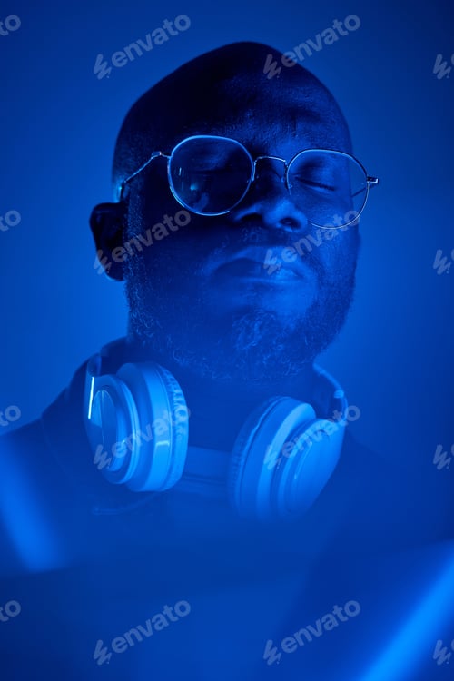 Preview: Meditating African American Man in Blue Light