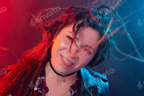 Preview: Youth, hairstyle and modern concept - young woman with dreadlocks smiling and having fun over the
