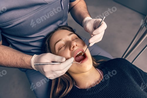 Preview: Male dentist working in dental clinic