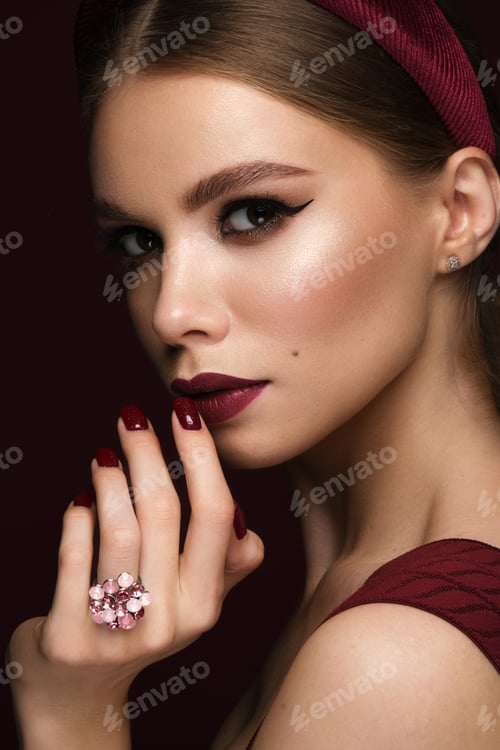 Preview: Beautiful sexy woman with classic make-up, fashion hair and red lips. Beauty face.