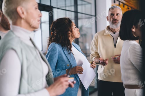 Preview: Businesspeople on briefing in modern office