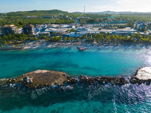 Preview: Aerial of the blue ocean and the beautiful Mambo beach in Curacao on a sunny day
