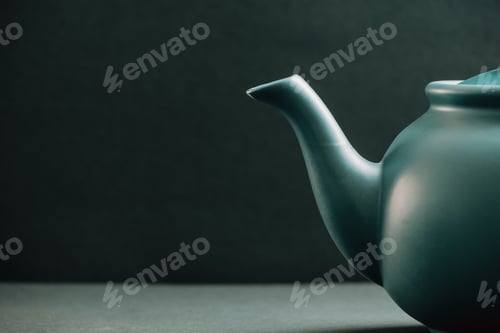 Preview: Teapot showing from the right corner over a dark background