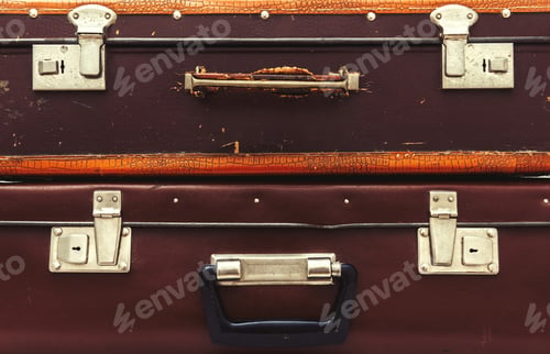 Preview: Front view of vintage leather suitcase with metallic locks in retro style