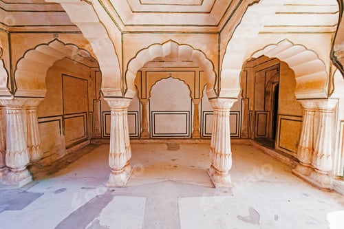Arched Hallway with Columns and Detailed Trim