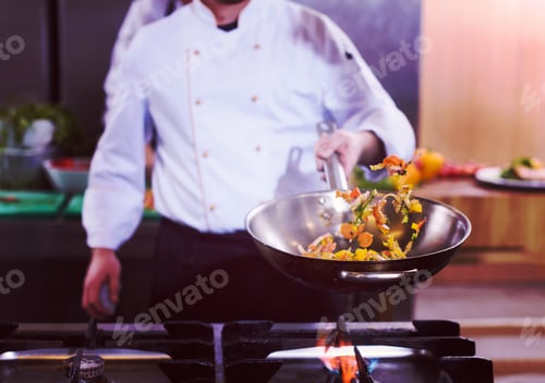 Preview: chef flipping vegetables in wok