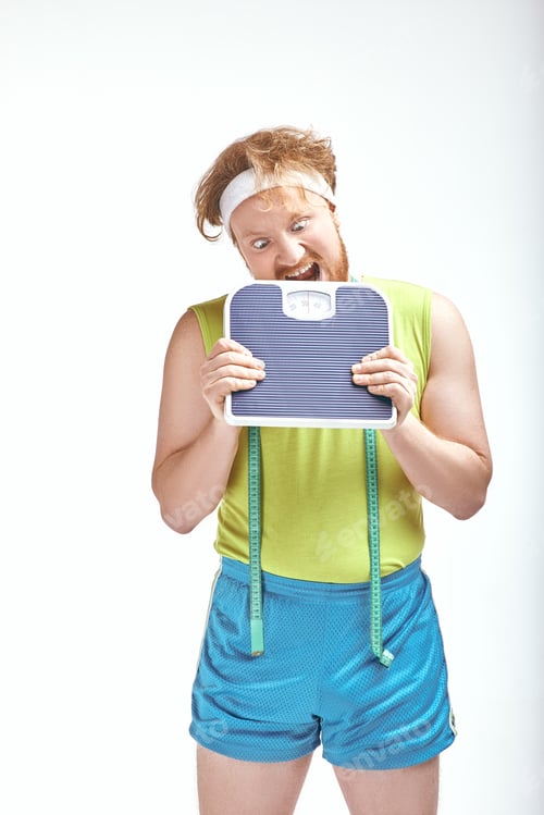 Preview: Red haired, bearded, plump man is angry with the scales