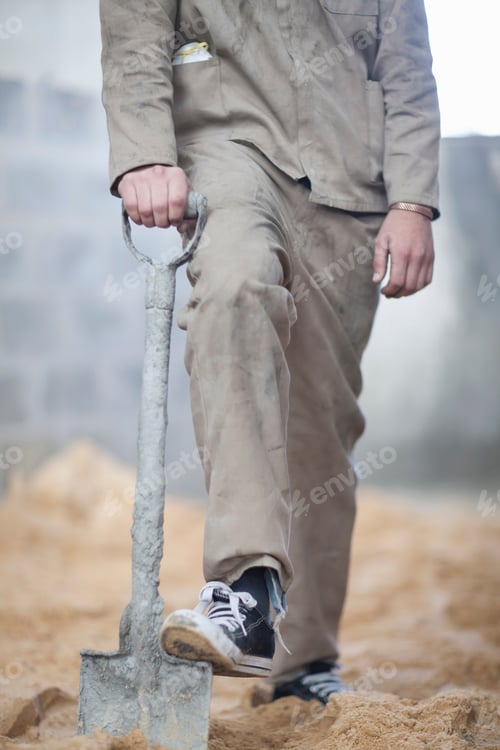 Preview: Man standing with spade