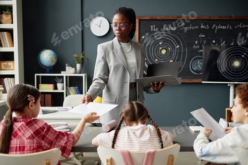 Preview: Black Woman Teaching Diverse Children Astronomy in Classroom Setting