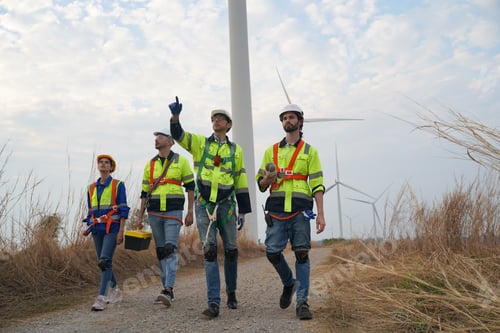 Preview: Sustainable energy industry - Engineers working at alternative renewable wind energy farm