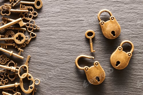 Preview: Various metal keys and locks on slate background