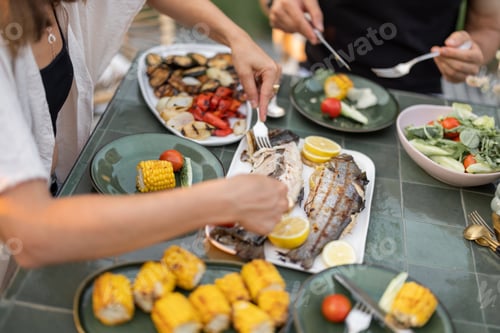 Preview: Eating grilled fish and vegetables, close-up
