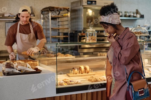Preview: Cafe Visitor Choosing Treat for Herself