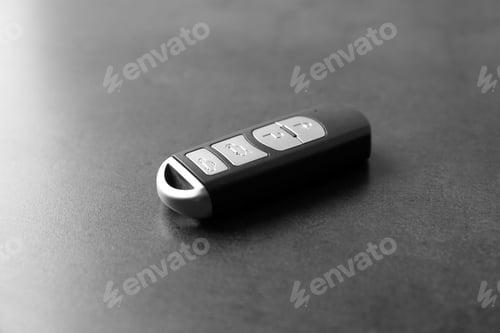 Preview: Modern car smart key on grey background