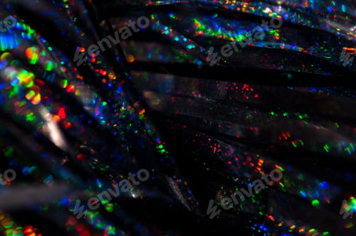 Preview: Colorful glowing rainbow drops and lights on black lined background.