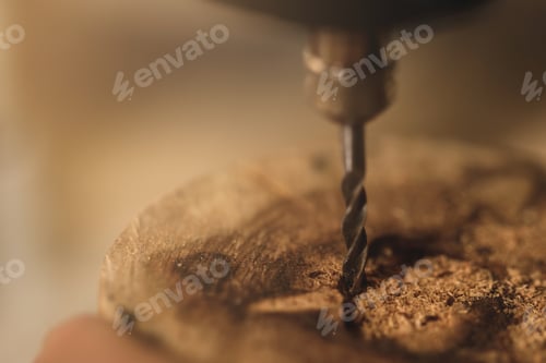 Preview: Close-up of drill bit in the piece of wood
