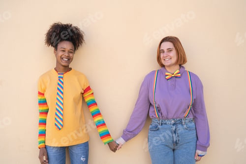 Preview: Happy women gay couple holding hands outdoor - Lgbt and love concept