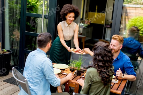 Preview: Friends grilling food and enjoying barbecue party outdoors