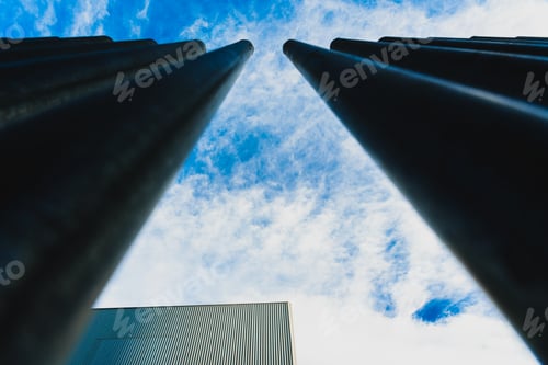 Preview: Vertical steel bars, a fence that separates and protects buildings from the street.
