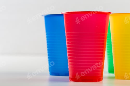 Preview: Multicolor disposable plastic glasses isolated on white background
