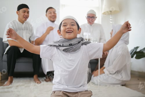Preview: Portrait of Happy Little Boy in Muslim Clothes Spreading Arms as He Celebrates Eid Mubarak Moment