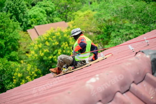Preview: Professional engineer worker installing solar panels system on rooftop