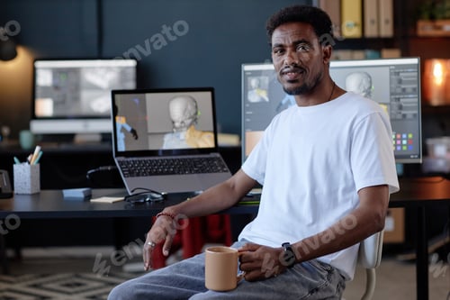 Preview: Portrait of African American Man Sitting at Office Desk