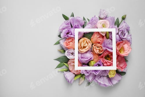 Preview: Flat lay composition with beautiful Eustoma flowers on grey background, space for text