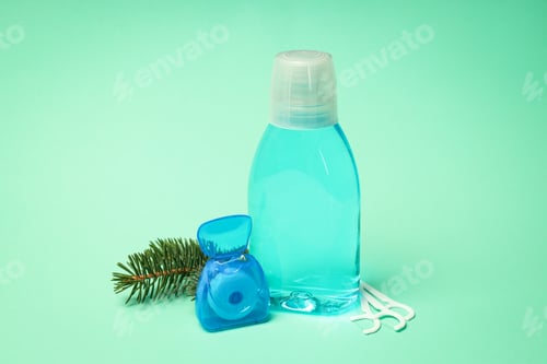Preview: Concept of tooth care on mint background