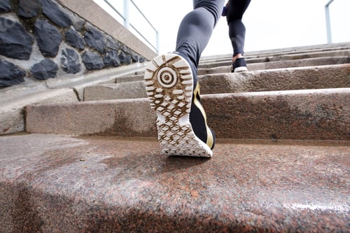 Preview: Female runner in action on staircase