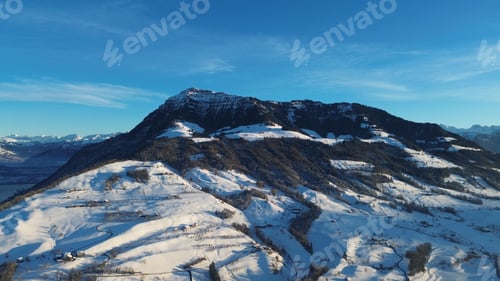 Preview: a large mountain range covered in snow with skis on top of it