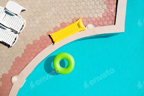 Preview: Inflatable ring floating in swimming pool, top view. Summer vacation