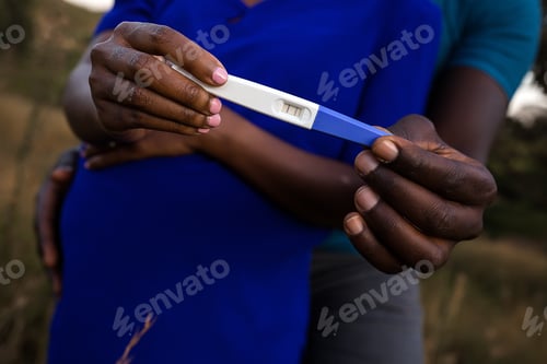 Preview: Needle medicinal pregnancy maternity baby bump couple hands details