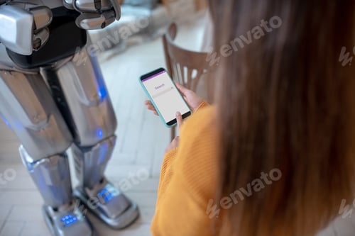 Preview: Girl with long hair holding a smartphone in her hand