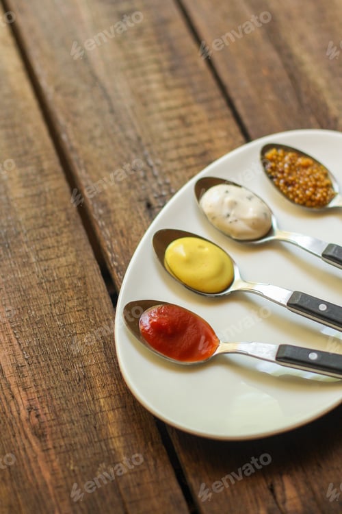 Preview: Sauce (Different Types Of Sauces In A Spoon) Portion Serving. Top Food Background. Copy Space