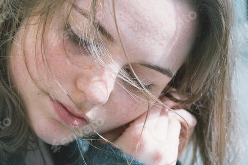 Preview: Beautiful woman face portrait freckles street city fashion nature. Girl in wool coat with jewelry.