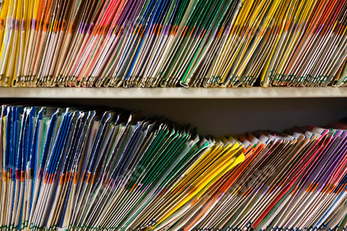 Preview: File Folders, crammed onto a shelf, colour coded