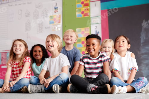 Preview: Group Of Elementary School Pupils Sitting On Floor In Classroom