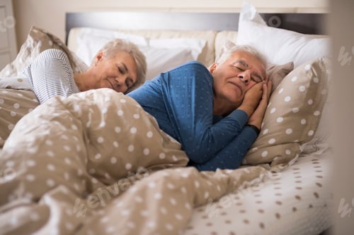 Preview: Senior Couple Sleeping Peacefully in Comfortable Bed