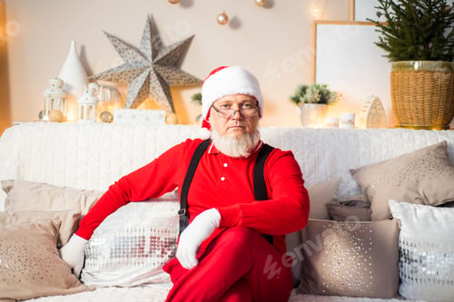 Preview: Santa Claus reads children's letters, wishes and gifts in a bright room. Christmas miracle.