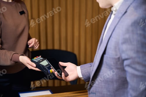 Preview: Woman administrator makes a payment through the terminal