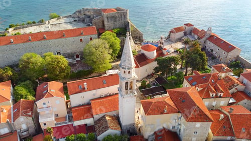 Preview: Panoramic sunset aerial drone view of ancient city of Budva, Montenegro. Old medieval town