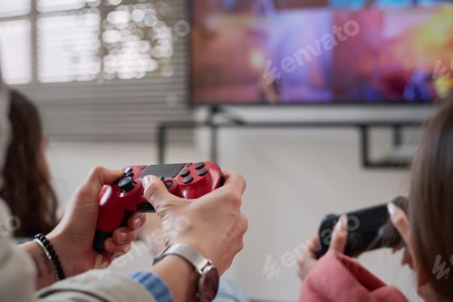 Preview: Family using joysticks to play video game