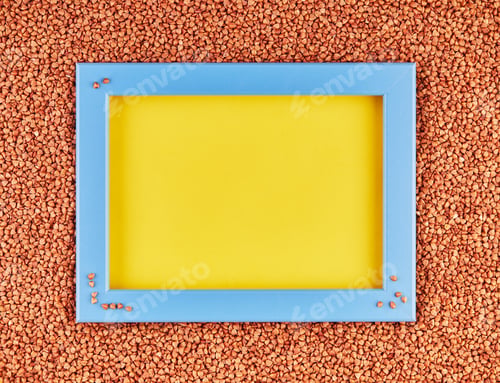 Preview: Scattered fresh dry buckwheat background - close-up buckwheat texture with a blue frame