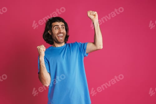 Preview: Excited brunette man screaming and making winner gesture