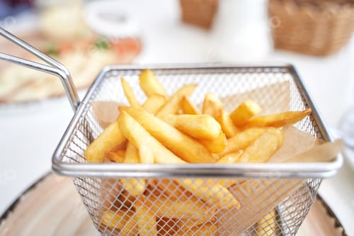 Preview: Basket with french fry. Potato chips. Cooking uhealthy lunch.