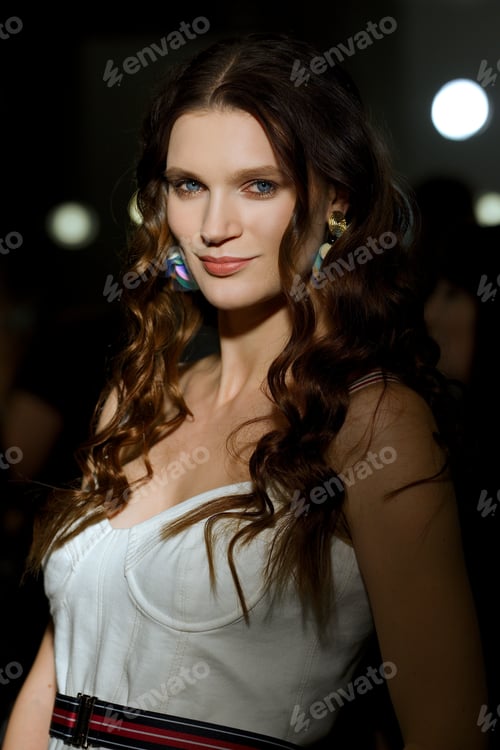 Preview: Pretty lady with clean and healthy skin posing in darkness with lights on background