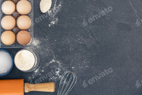 Preview: Baking background. Ingredients for baking cakes. Eggs, flour and rolling pin.