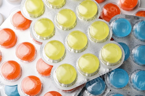 Preview: Blisters with color cough drops as background